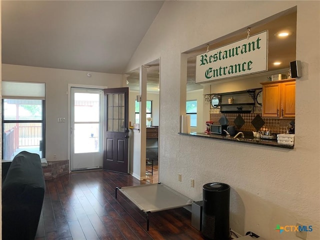 3002 Veterans Ave, Copperas Cove, TX 76522 - living area featuring vaulted ceiling, dark wood finished floors, and a textured wall