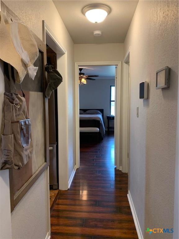 3002 Veterans Ave, Copperas Cove, TX 76522 - hall featuring wood finished floors and a textured wall