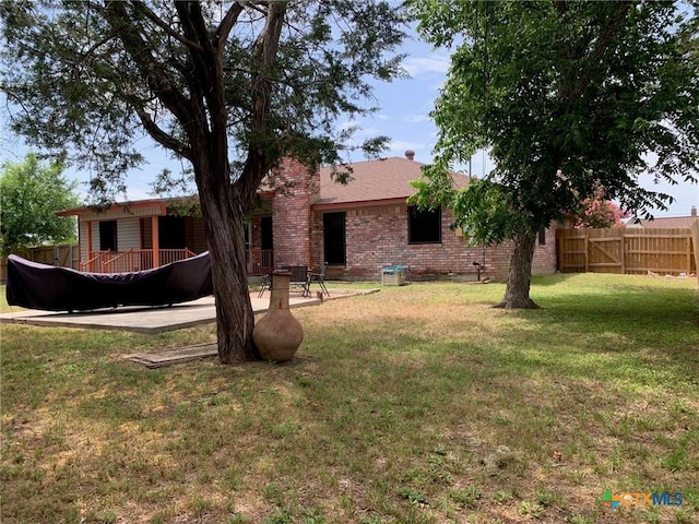 3002 Veterans Ave, Copperas Cove, TX 76522 - back of house featuring brick siding and a patio