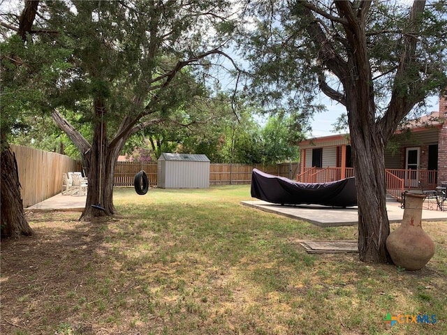 3002 Veterans Ave, Copperas Cove, TX 76522 - fenced backyard with a storage unit, a deck, and a patio