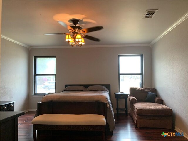 3002 Veterans Ave, Copperas Cove, TX 76522 - bedroom with dark wood-style floors, a ceiling fan, and crown molding