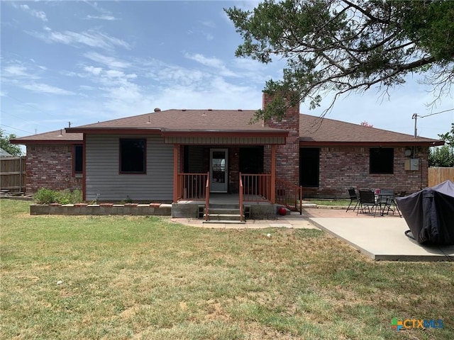 3002 Veterans Ave, Copperas Cove, TX 76522 - rear view of house with a chimney, brick siding, and a patio area