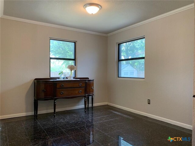 3002 Veterans Ave, Copperas Cove, TX 76522 - empty room featuring granite tiled floors, healthy amount of natural light, and crown molding
