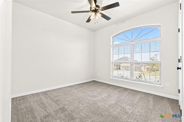 empty room featuring ceiling fan and carpet floors