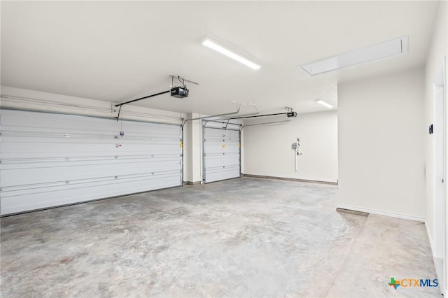 garage featuring a garage door opener