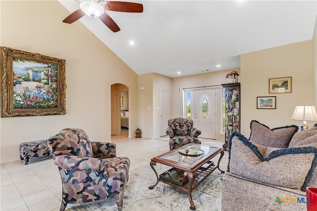 1518 Skyline Dr, Kingsland, TX 78639 - living area featuring arched walkways, ceiling fan, recessed lighting, light tile patterned floors, and high vaulted ceiling