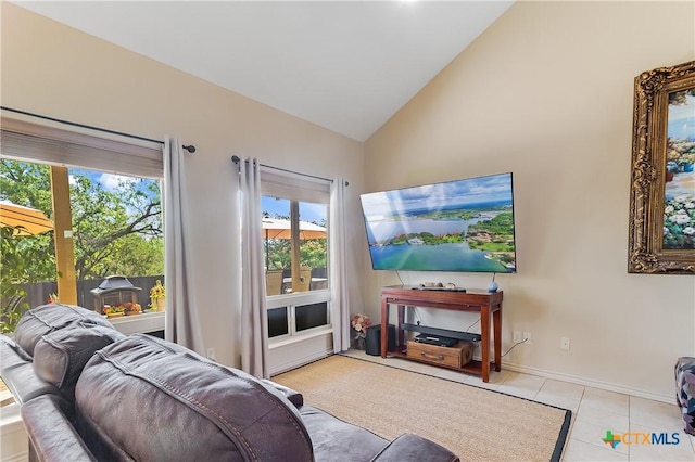 1518 Skyline Dr, Kingsland, TX 78639 - tiled living room featuring plenty of natural light, high vaulted ceiling, and baseboards