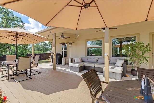 1518 Skyline Dr, Kingsland, TX 78639 - deck with outdoor dining space, ceiling fan, and outdoor lounge area