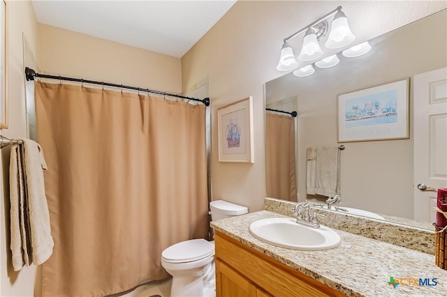 1518 Skyline Dr, Kingsland, TX 78639 - bathroom with toilet, vanity, and a shower with shower curtain