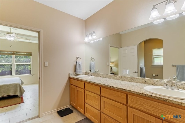 1518 Skyline Dr, Kingsland, TX 78639 - full bathroom with healthy amount of natural light, tile patterned flooring, ensuite bath, and double vanity