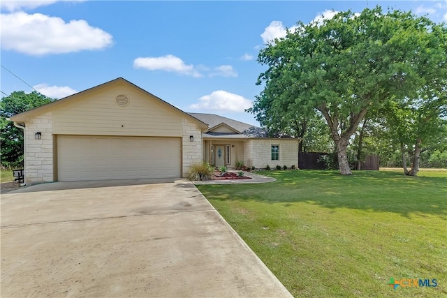 1518 Skyline Dr, Kingsland, TX 78639 - view of front of home with concrete driveway, an attached garage, and stone siding