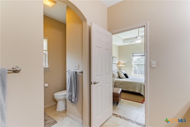 1518 Skyline Dr, Kingsland, TX 78639 - bathroom with tile patterned flooring, ceiling fan, toilet, ensuite bath, and baseboards