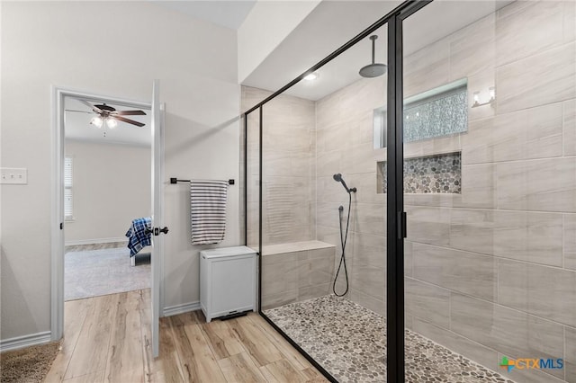 705 Juniper Dr, Troy, TX 76579 - ensuite bathroom with a stall shower, a ceiling fan, and wood finished floors