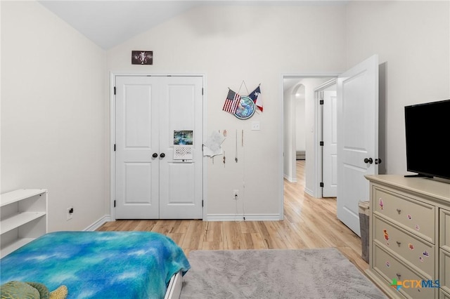 705 Juniper Dr, Troy, TX 76579 - bedroom featuring light wood-style floors, lofted ceiling, and a closet