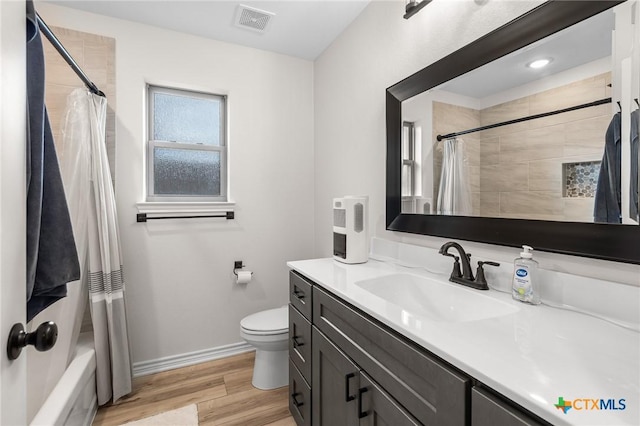 705 Juniper Dr, Troy, TX 76579 - full bathroom with vanity, wood finished floors, and shower / bath combination with curtain