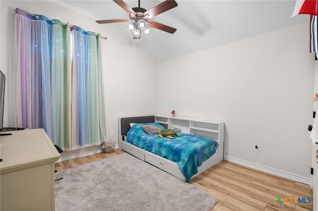 705 Juniper Dr, Troy, TX 76579 - bedroom featuring wood finished floors, vaulted ceiling, and a ceiling fan