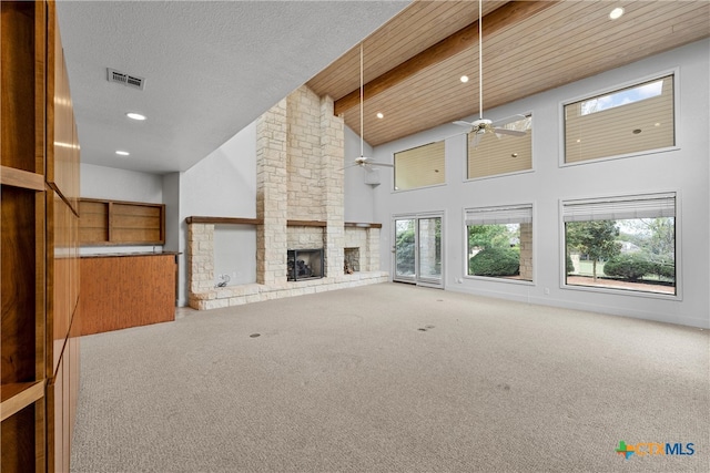 unfurnished living room featuring ceiling fan, carpet flooring, and high vaulted ceiling