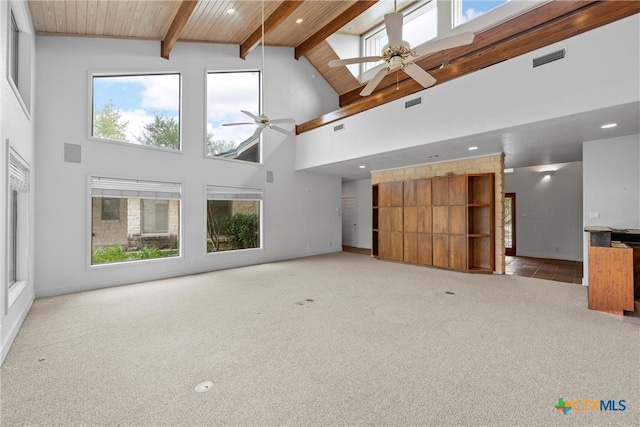 unfurnished living room with wood ceiling, light carpet, high vaulted ceiling, beamed ceiling, and ceiling fan