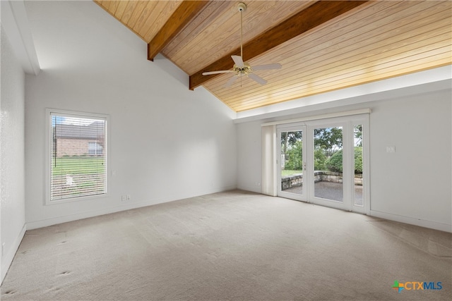 carpeted empty room with high vaulted ceiling, wood ceiling, ceiling fan, and beam ceiling