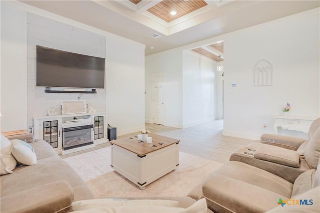 2306 Wooster St, Nolanville, TX 76559 - living area with a glass covered fireplace, crown molding, coffered ceiling, visible vents, and baseboards