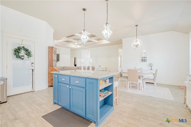 2306 Wooster St, Nolanville, TX 76559 - kitchen with light wood-style floors, coffered ceiling, open shelves, and blue cabinetry