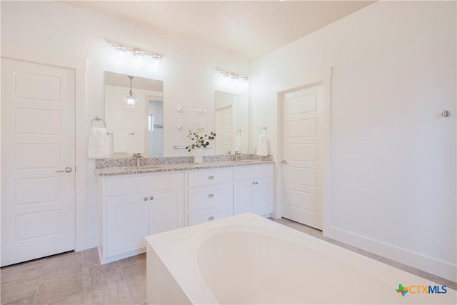 2306 Wooster St, Nolanville, TX 76559 - full bathroom with double vanity, a bathing tub, and a sink