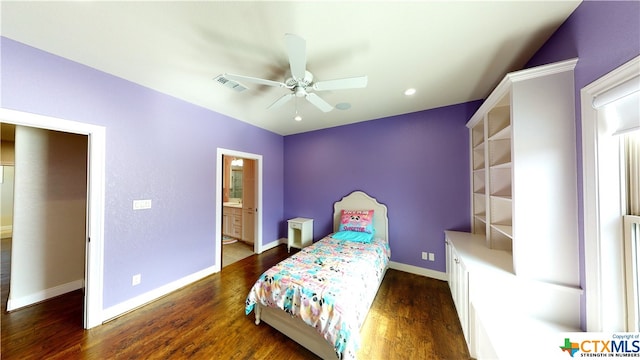 bedroom featuring dark wood-type flooring, ceiling fan, and connected bathroom