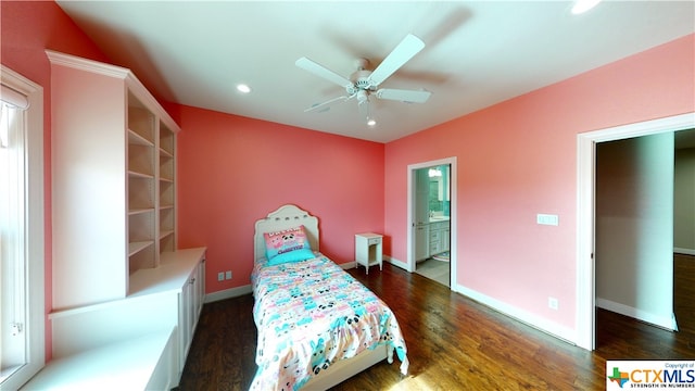 bedroom featuring dark hardwood / wood-style floors, ceiling fan, and connected bathroom