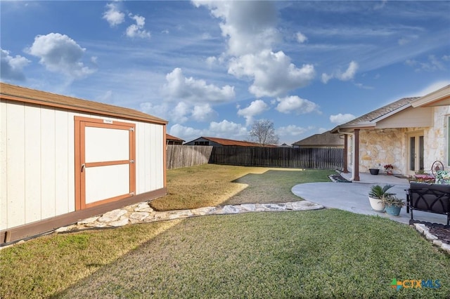 view of yard with a patio area and a shed