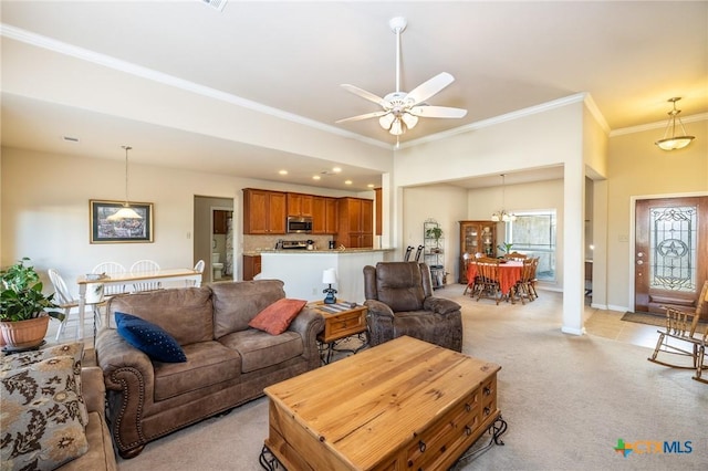 living room featuring crown molding, light carpet, and ceiling fan with notable chandelier