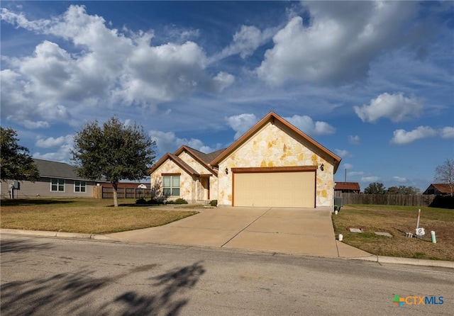 view of front facade featuring a garage and a front yard