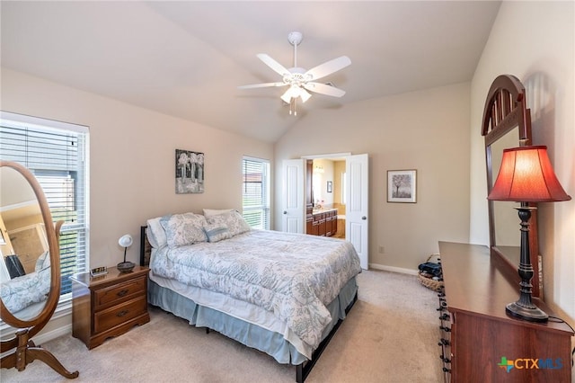 bedroom with vaulted ceiling, ceiling fan, and light colored carpet