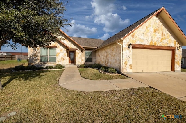 ranch-style house featuring a front yard and a garage