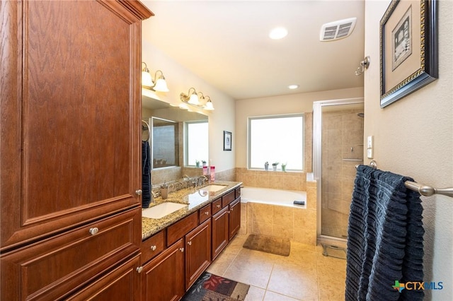 bathroom with vanity, tile patterned floors, and independent shower and bath