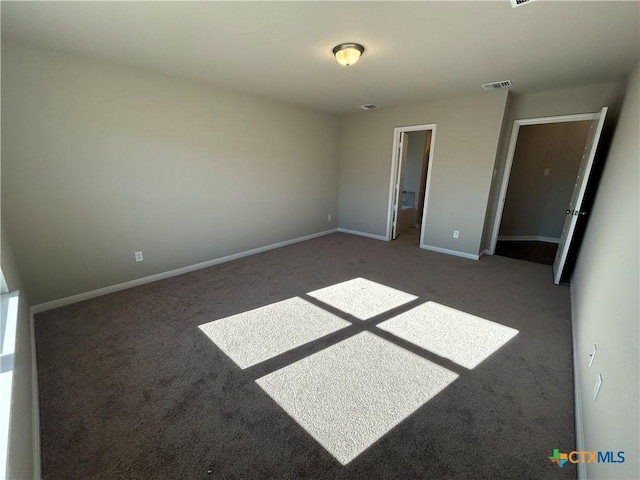 unfurnished bedroom featuring carpet