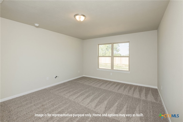 empty room featuring carpet flooring