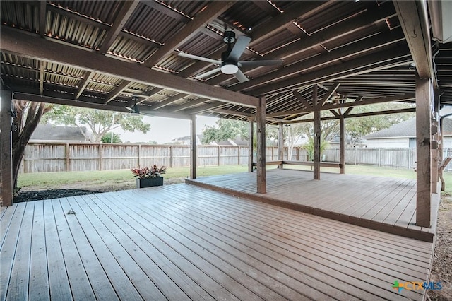 wooden terrace featuring fence and ceiling fan