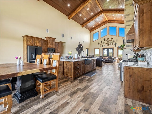 12093 Sulphur Springs Rd, Adkins, TX 78101 - kitchen with stainless steel appliances, high vaulted ceiling, wooden ceiling, open floor plan, and dark wood-style floors