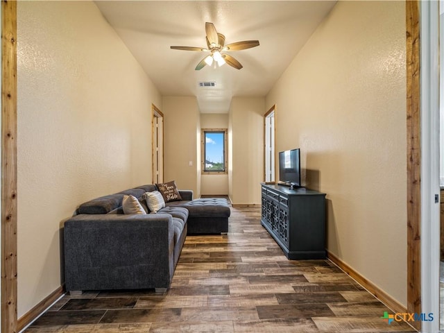 12093 Sulphur Springs Rd, Adkins, TX 78101 - living room featuring dark wood-style flooring, ceiling fan, and baseboards