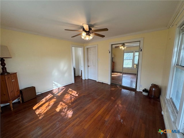 spare room featuring dark hardwood / wood-style floors, ceiling fan, and ornamental molding