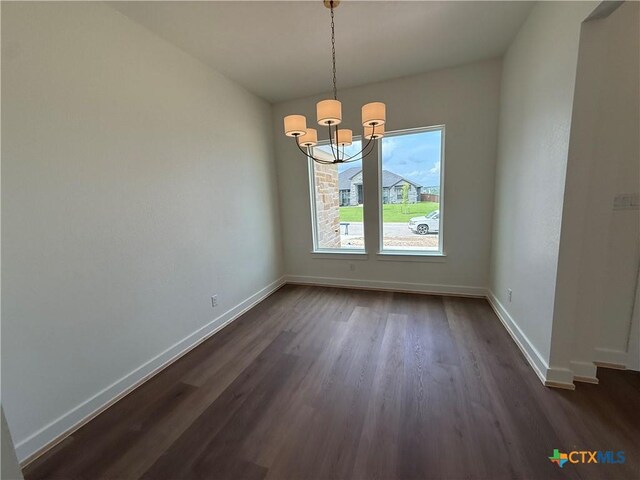 901 High Plains Dr, Nolanville, TX 76559 - unfurnished dining area featuring baseboards, a chandelier, and dark wood-style flooring