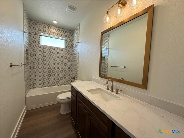 901 High Plains Dr, Nolanville, TX 76559 - bathroom featuring vanity, toilet, shower / washtub combination, and wood finished floors
