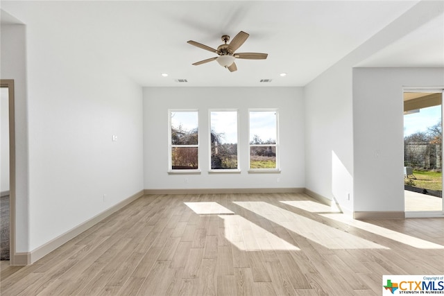 unfurnished room with ceiling fan and light hardwood / wood-style floors