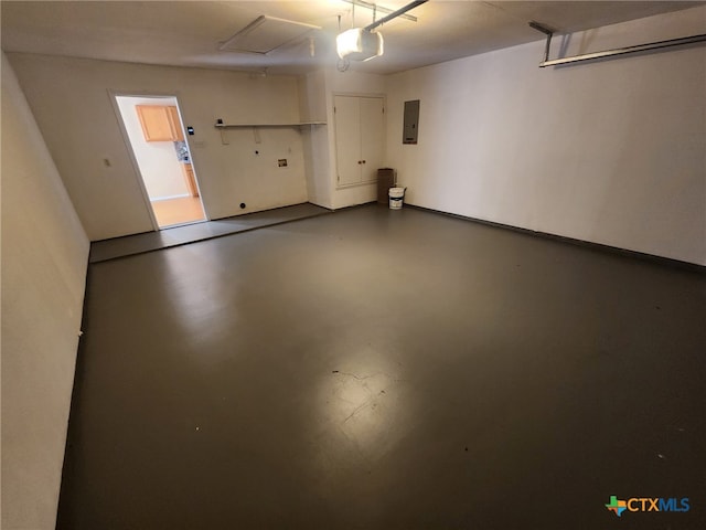 garage featuring a garage door opener and electric panel