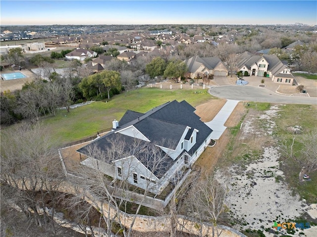 birds eye view of property with a residential view