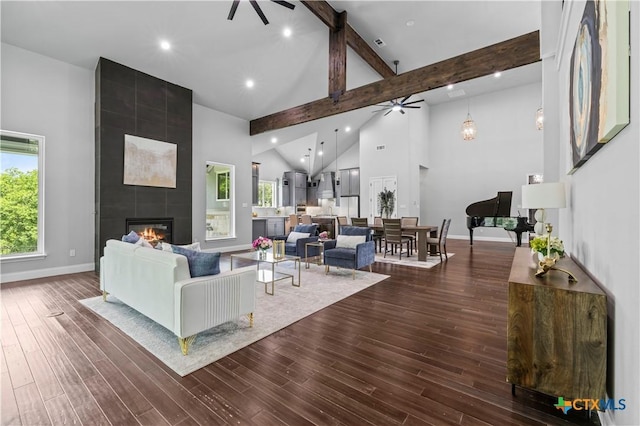 6817 Misty Creek Ln, Temple, TX 76502 - living area featuring a ceiling fan, a large fireplace, high vaulted ceiling, beam ceiling, and healthy amount of natural light