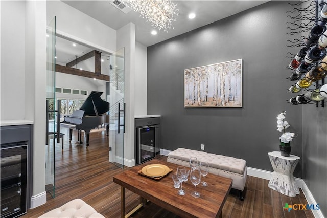 living room with wine cooler, recessed lighting, wood finished floors, visible vents, and baseboards