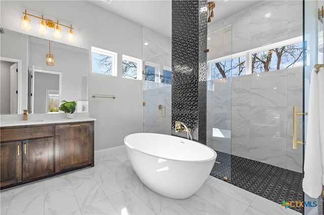 full bathroom featuring marble finish floor, a soaking tub, a shower stall, and a healthy amount of sunlight