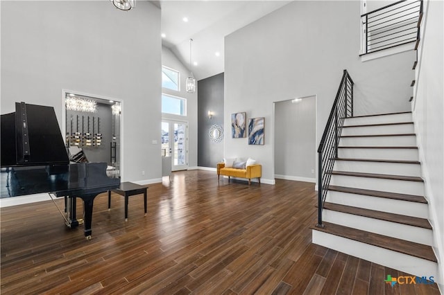 foyer with recessed lighting, wood finished floors, baseboards, stairs, and french doors