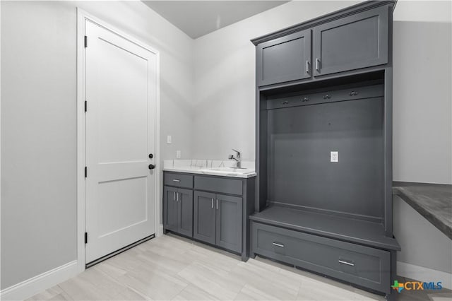 mudroom featuring a sink